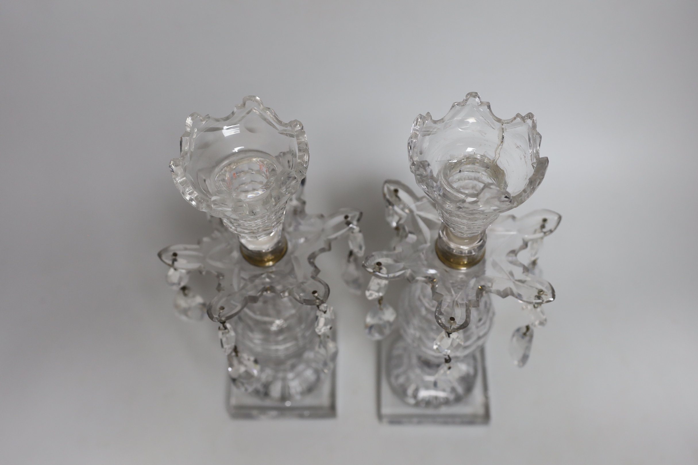 A pair of early 19th century cut glass table lustres, on faceted square bases, 26cm